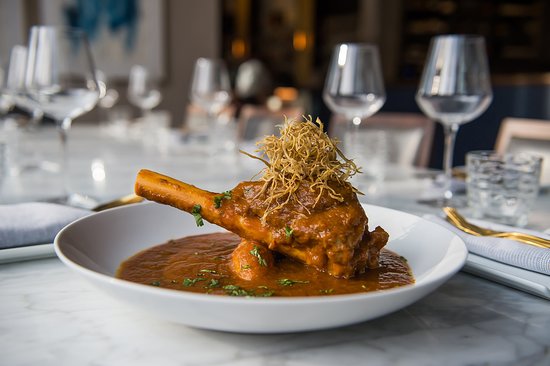 Karma Modern Indian signature dishes Kashmiri ChickenScallops with Turmeric RisottoLamb Shank Rogan Josh﻿﻿